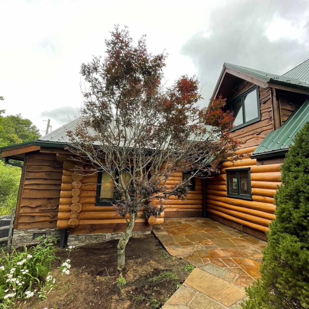 a log cabin stained by Baldwin Restoration